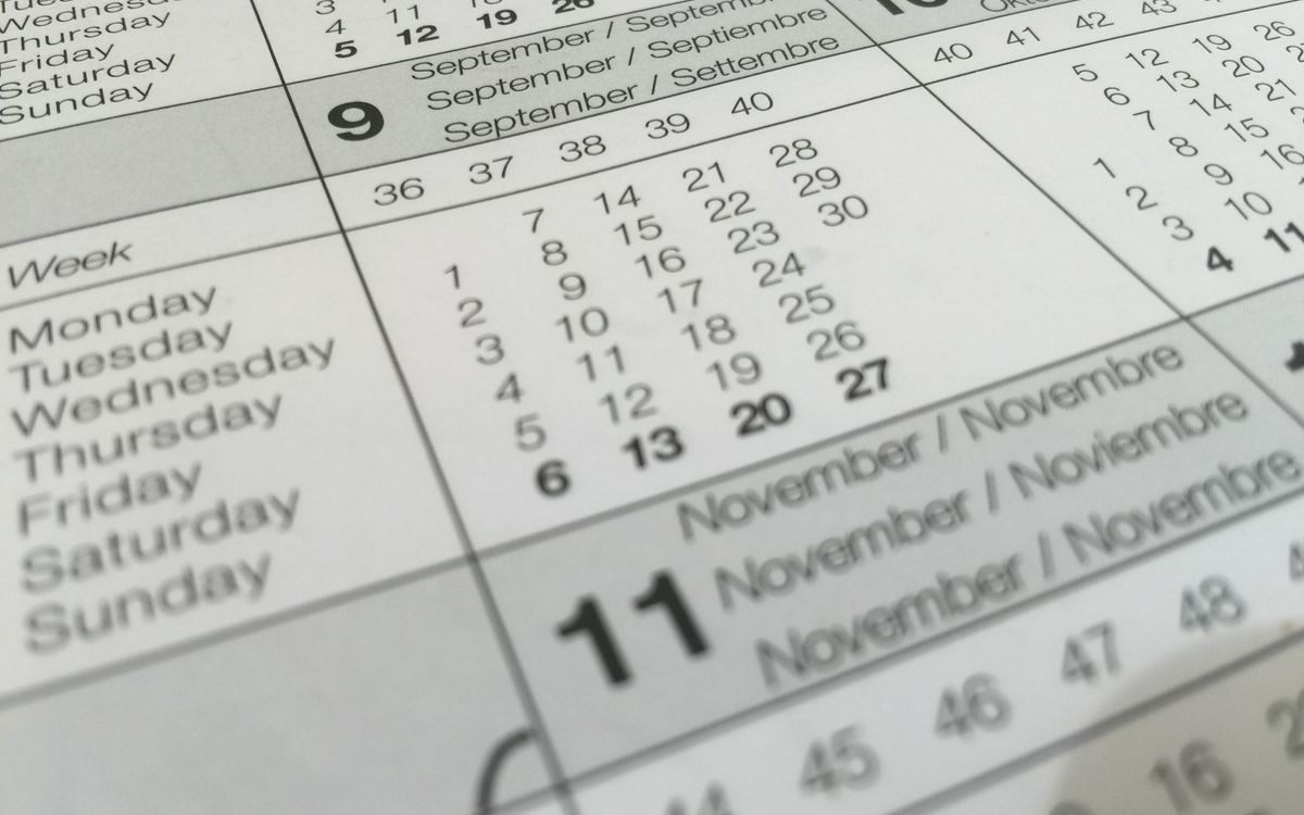 A close-up of a year planner covered in dates and weekday names