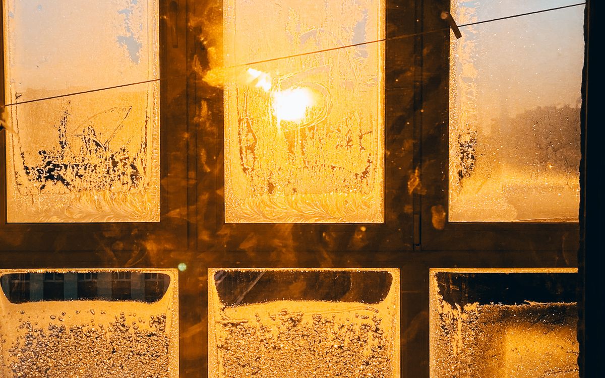 Winter sun coming through a frosted window pane